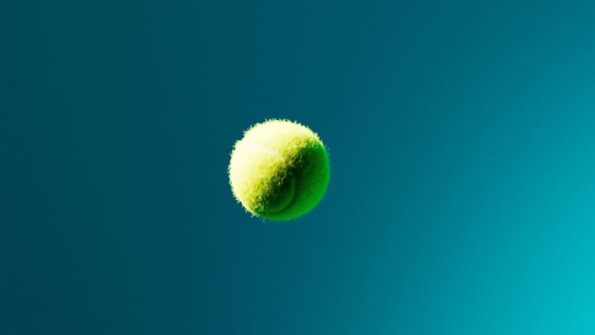 Slow-motion animation of the tennis racket striking the ball. A player hits a ball playing a match. The camera is focusing on the play ball and rising particles in the air. In the middle of the game. | Shutterstock HD Video #1066663243