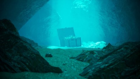 A secret treasure on the seabed in a mysterious underwater cave. An open old wood trunk is full of jewellery, coins and gold lighted by entering rays of the sun. Abounded pirate chest in blue water.