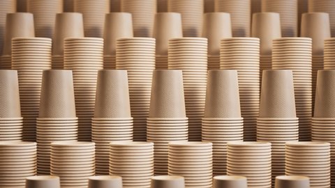 Footage of assorted disposable cups for coffee, tea, hot chocolate or any other beverage. Stacks of paper cups. Set of many cups for a fast-food restaurant, coffee shop, cafe. Close up. Zooming in.