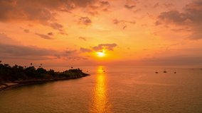 Amazing light sunset or sunrise over tropical sea with rocks seashore in the foreground Time Lapse video nature landscape Beautiful light of nature scenery stunning view