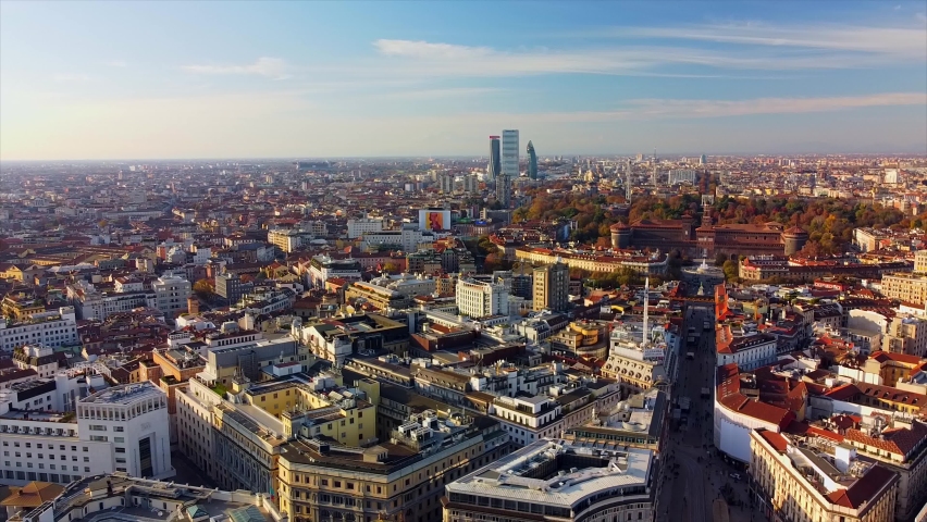 The modern architecture of the city - skyscrapers, business buildings, krishi - houses of three new towers from a helicopter. Sunset on the horizon. Fog in the city. drone. Milan Italy 02: 02: 2021: | Shutterstock HD Video #1066673197