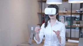 New generation women in virtual reality headset do instructional at home office