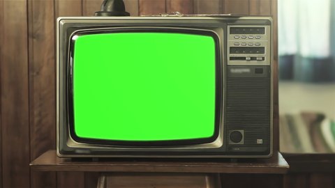 Vintage Television Set with Green Screen Background. Zoom In. You can replace green screen with the footage or picture you want. You can do it with “Keying” effect in After Effects. 4K Resolution.