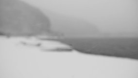 Bokehed Background Video of Snowing at a Lake (Slow Motion, Seamless Looping)