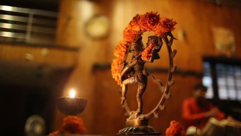 Statue of Shiva, incense and candles