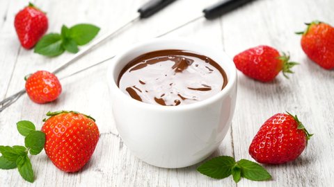strawberry dipping in chocolate sauce