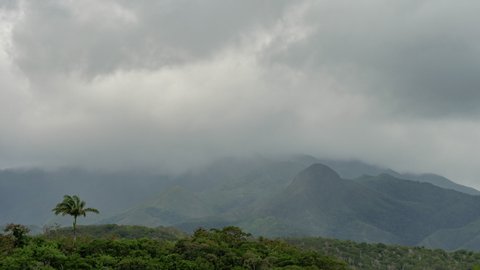Thick rain clouds dump water on Mount Koghi near Nouméa, New Caledonia. Timelapse.