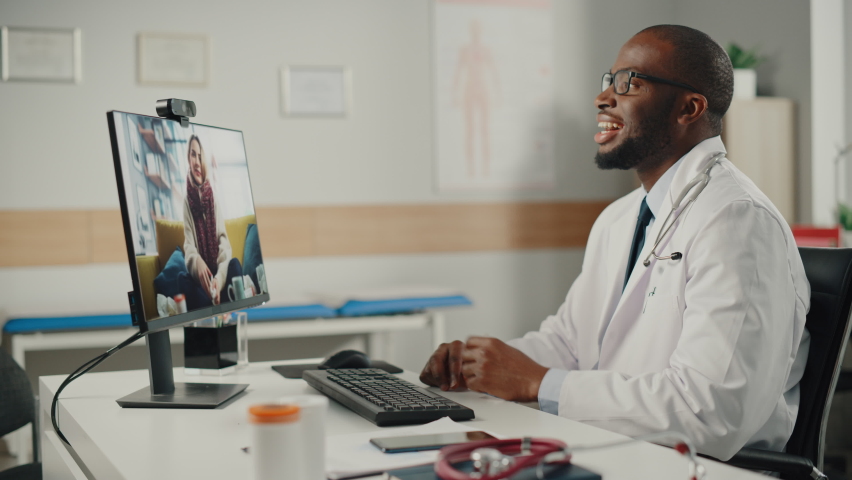 Doctor's Online Medical Consultation: African American Physician Making a Conference Video Call with a Patient on a Desktop Computer. Health Care Professional Giving Advice, Explaining Test Results. | Shutterstock HD Video #1066706707