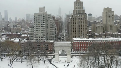 aerial drone flying over arch of Washington Square Park in New York City NYC