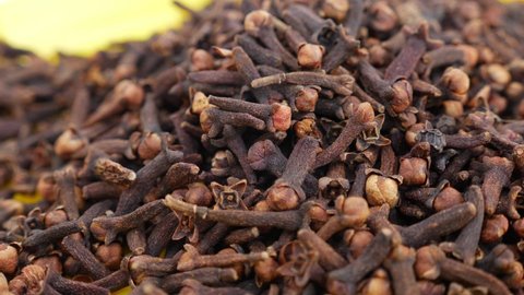 Close view of heap of cloves, Cloves placed in a plate