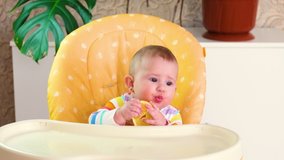 baby eats lemon. selective focus.