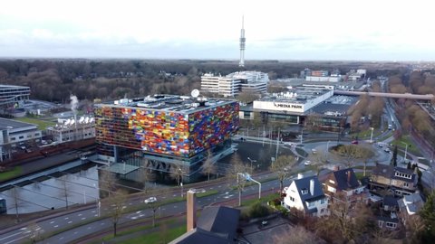 HILVERSUM, THE NETHERLANDS - JANUARY 26 2021: a shot flying towards the Netherlands Institute for Sound and Vision and the Media Park drone and television studios and sets.