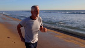 64 year old man getting his exercise at the beach at sunset. - Powered by Shutterstock - Get 15% off with code: PIKWIZARD15