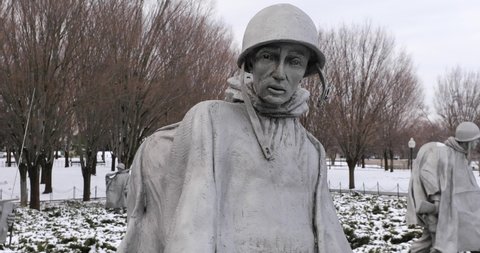 Washington, DC, USA - February 1, 2021: The Korean War Veterans Memorial is covered in snow after a winter storm passes over the city. 