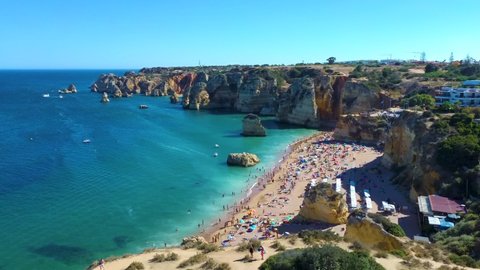 Aerial view of Benagil caves and the Atlantic ocean coast. Lagoa, Algarve, Portugal.