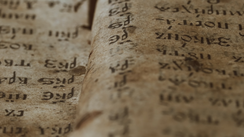 Slider shot over pages with candle wax stains of old antique religious book. Orthodox, psalter, 19th century, prayers and psalms. Cyrillic Church Slavonic font. History, archives and research concept. | Shutterstock HD Video #1066740229