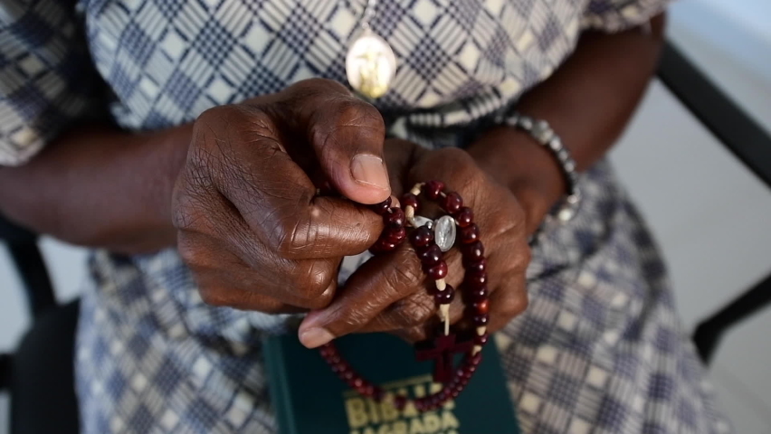 tired hands praying the rosary I