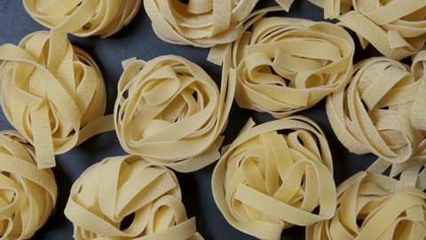 Top view of raw fresh pasta Durum wheat pasta. Food background. Close up.