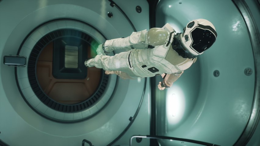An astronaut in zero gravity checks the module of his spaceship. The animation is for fantastic, the futuristic or space travel backgrounds. Royalty-Free Stock Footage #1066758871