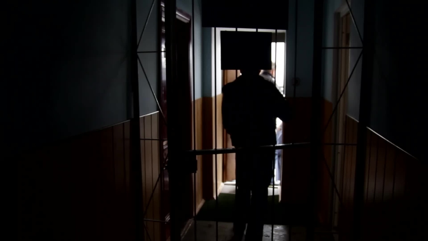 Walk through the prison corridor. Prisoner enter into the cell, doors are closing. | Shutterstock HD Video #1066766647