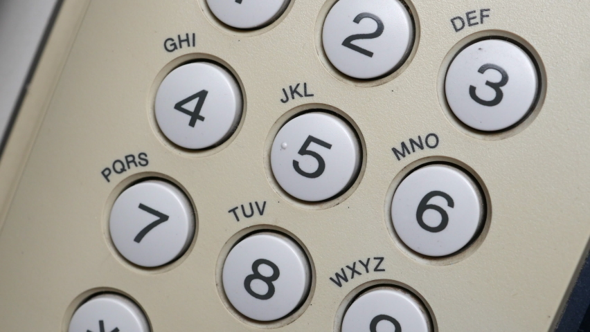 Finger Of Doctors With Blue Protection Gloves Dials On The Number Buttons On The White Fax Telephone. A Doctor