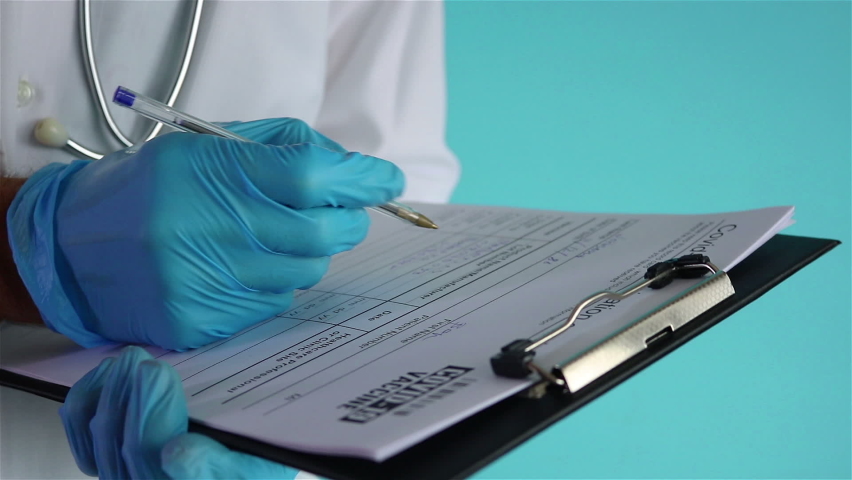doctor filling the medical form covid 19 vaccination card  close up soft focus Royalty-Free Stock Footage #1066786195