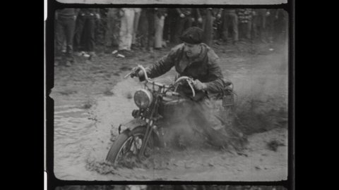 1940s Lansing, MI. Man Rides Harley-Davidson Motorbike trough Muddy Conditions at Jack Pine Endurance Run, Popular Event among WWII Veterans, 4K Overscan of Vintage Archival 16mm Film Print