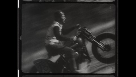 1930s Orange County, CA. Daredevil Motorbike Rider attempts Hill Climb on Capistrano Hill. Wearing Leather Helmet and Harley-Davidson Long Sleeve Shirt, Man Flips Motorbike. 4K Overscan of 16mm Film 