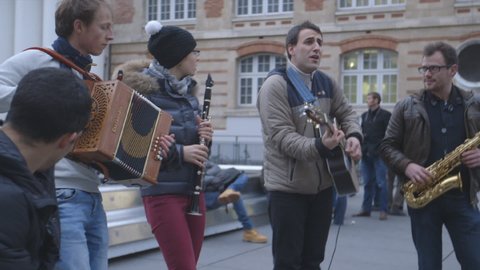 PARIS, FRANCE - DECEMBER 2015: A folk band playing music beside The Centre Pompidou