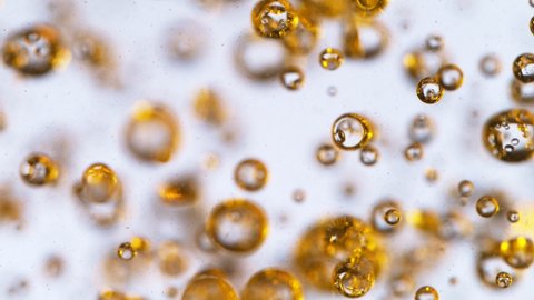 Super Slow Motion Shot of Moving Oil Bubbles on White Background at 1000fps