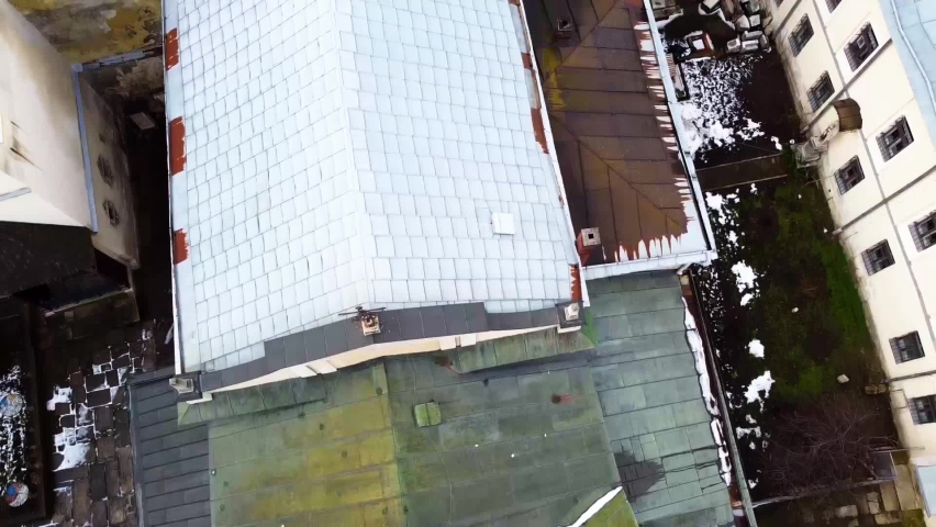 Aerial view of a drone flying over the building.