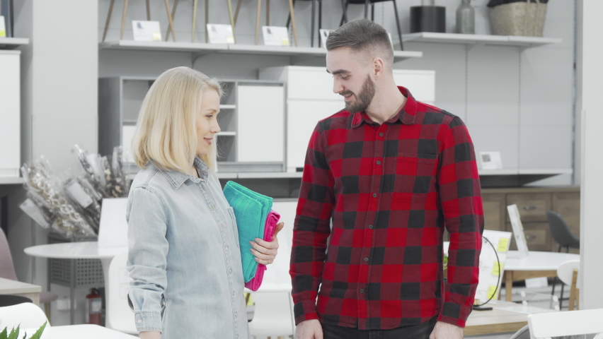 Young couple looking around at furnishings store