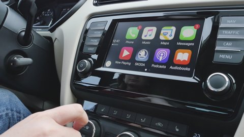 Paris, France - Circa 2017: Siri requires an internet connection message on the infotainment dashboard of a new car with Apple CarPlay iOS - open Audiobooks and podcasts app