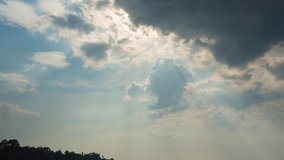 timelapse b roll on sunday's shine through huge dark clouds in middle day in summer season. cloudscape nature background for water forecast for tourism. sunbeam sun rays in blue sky cloudy day. 4k VDO