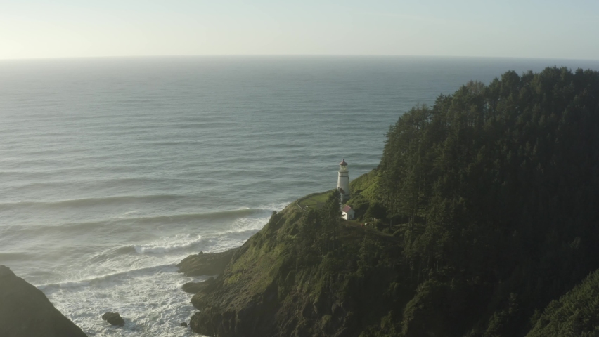 Right to left tracking aerial of Haceta Head lighthouse in Oregon