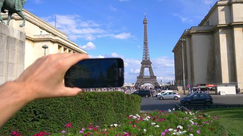 POV on taking picture of Eiffel Tower in Paris in 4K slow motion 60fps