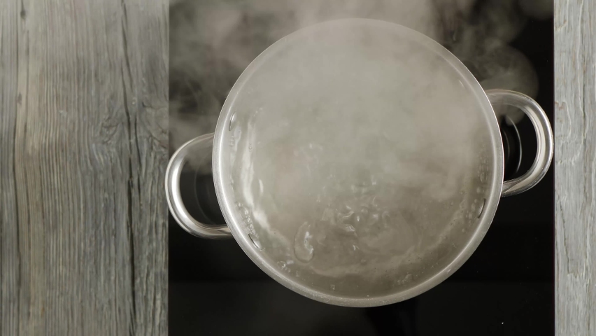 Boiling water in a pot. Boiling point. View from above. Royalty-Free Stock Footage #1066827076