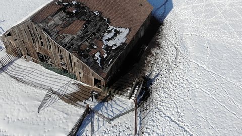 Aerial Pan of Broken Down Barn with Snow - Drone