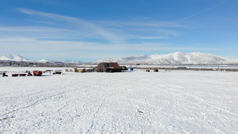 Aerial Flight Over Winter Ranch with Snow and Old Barn - Drone