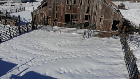 Aerial Tilt Up of Old Barn in Winter with Snow - Aerial Drone