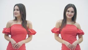 Slowmotion video of two twins sisters in the same red dresses clapping and giving thumb up over white background