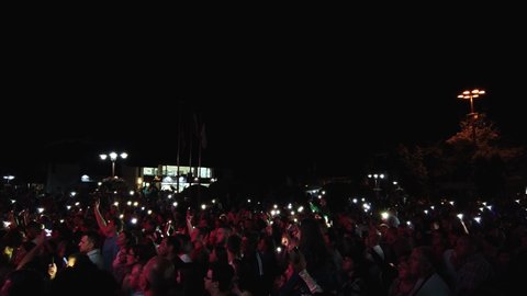 Bansko, Bulgaria - 08 Sep, 2019: Crowd With Smartphone Flash Lights enjoy on public concert in Bansko watching celebrity singer Ceca Raznatovic