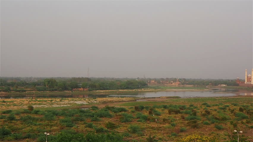View of Taj Mahal on the bank of Yamuna River in the morning, India