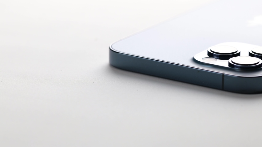 Klaipeda, Lithuania - January 30, 2021: Close up view of a new modern phone- Iphone 12 pro max lying on a flat surface.