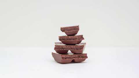 Stop motion video, slices of chocolate in stack disappear.