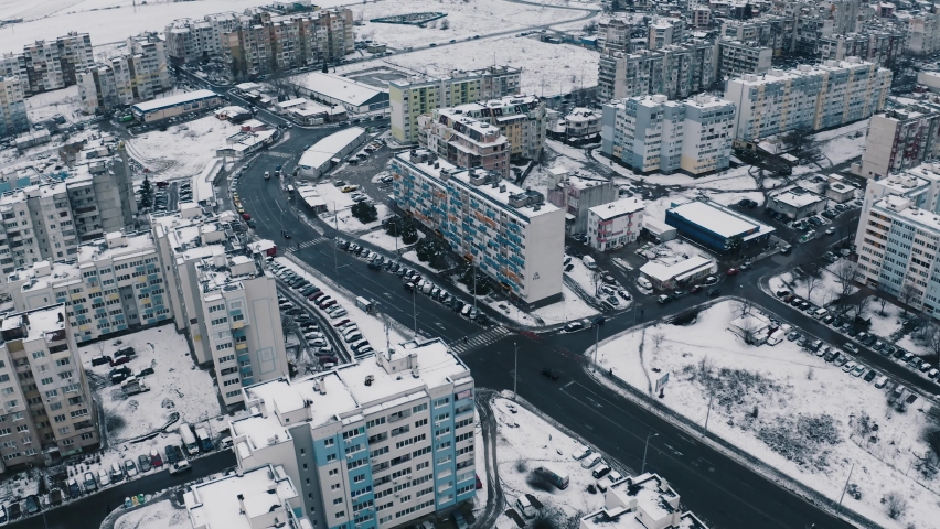 Aerial drone fly over Snowy Street City and Traffic | Shutterstock HD Video #1066863352