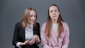 Video of woman telling a story to her indifferent friend