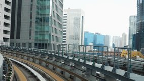 4K Video of Japan metro train moving into the platform with cityscape view