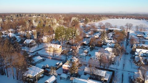 Aerial View of Suburban Neighborhood Covered in Snow. Horse Racing Track Morning after winter storm. Saratoga Springs New York. 