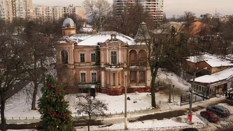 UKRAINE, ODESSA - JANUARY 28, 2021: Overview of the old destroyed non-residential building with broken windows in Odessa city centre. On the fences reads: "Vandals leave our city".
